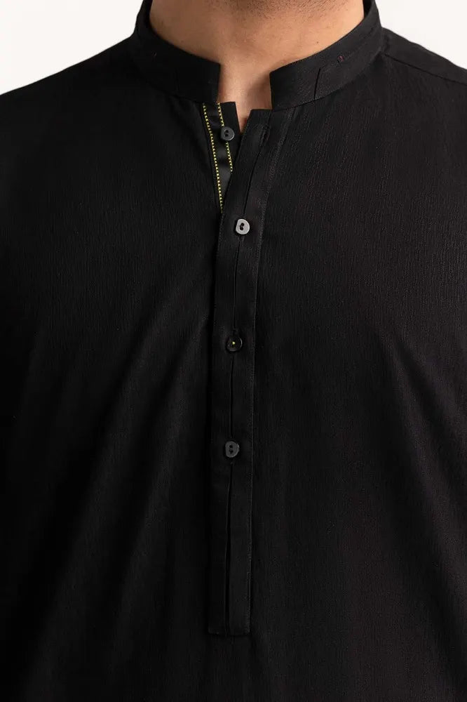 High-quality blended fabric of GulAhmed’s black suit, ensuring comfort and durability for semi-formal wear.