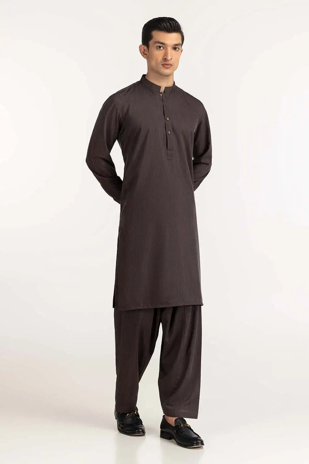 Side profile of GulAhmed’s brown 2-piece suit, showcasing its sleek fit – a premium pick for Pakistani suits for men in Canada.