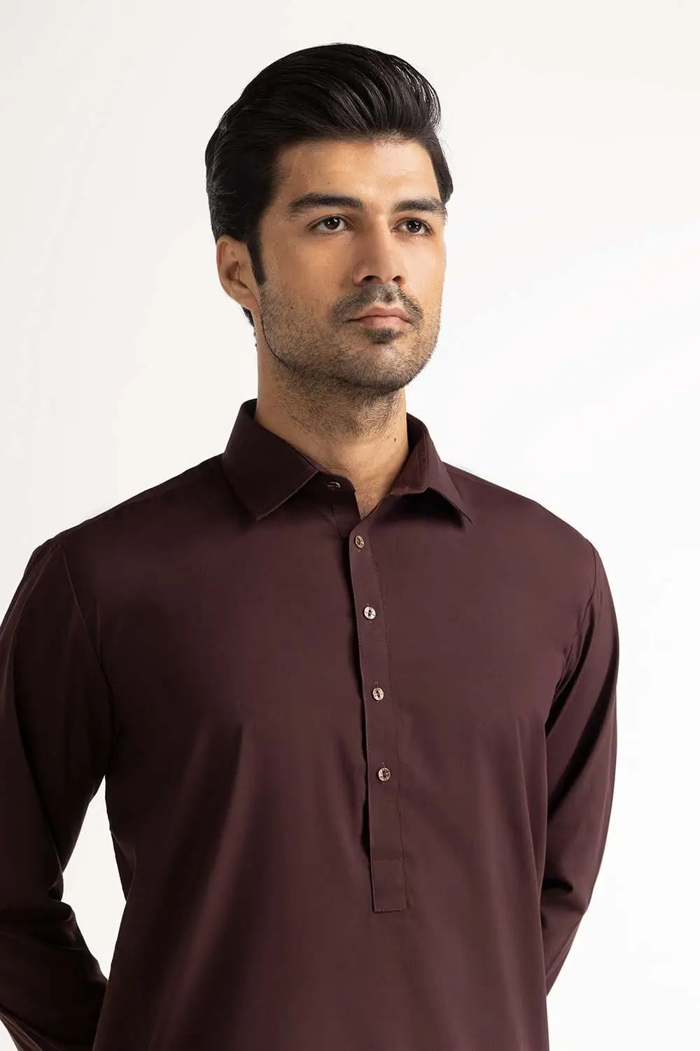 Side profile of GulAhmed’s burgundy suit, featuring a tailored fit – a top option for Pakistani suits for men in Canada.