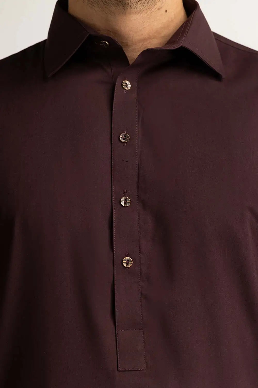 Detailed texture of GulAhmed’s burgundy blended suit, highlighting its premium fabric for formal Pakistani wear in Canada.