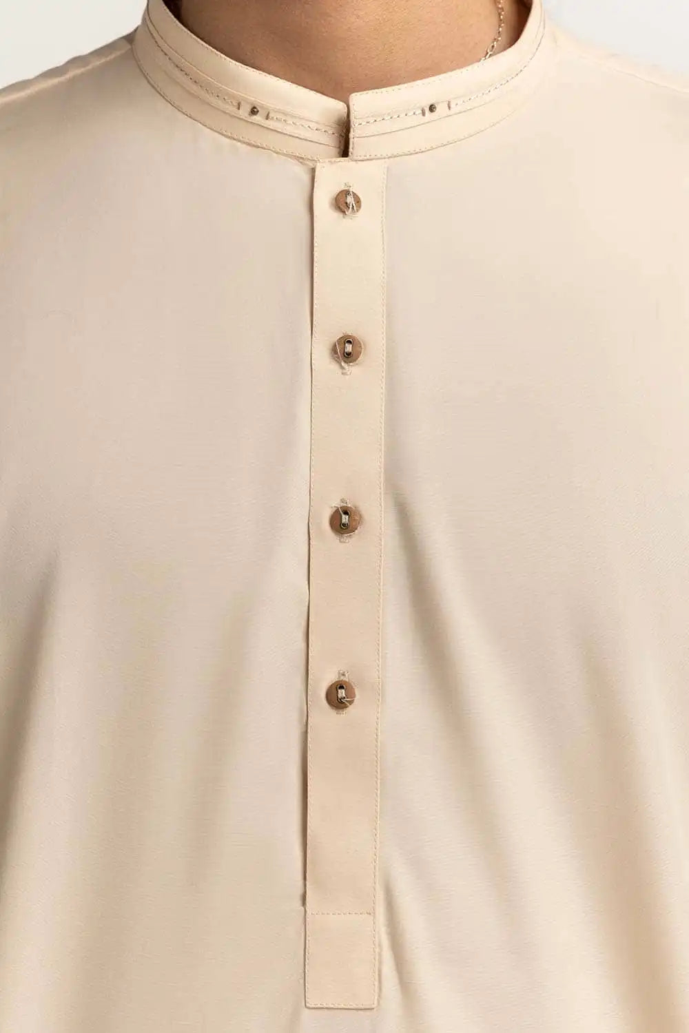 closeup of Premium blended fabric of GulAhmed’s cream suit, ensuring comfort and durability – a must-have for Pakistani suits in Canada.