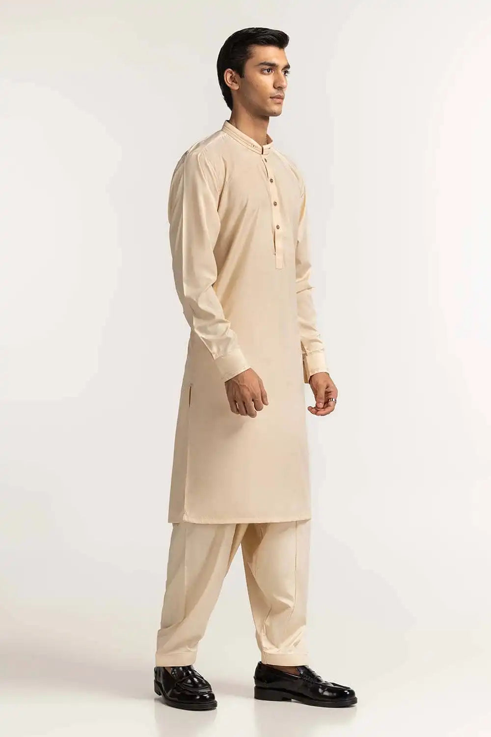Pakistani suits in Canada – GulAhmed’s cream blended suit offers timeless style and quality craftsmanship for formal wear.