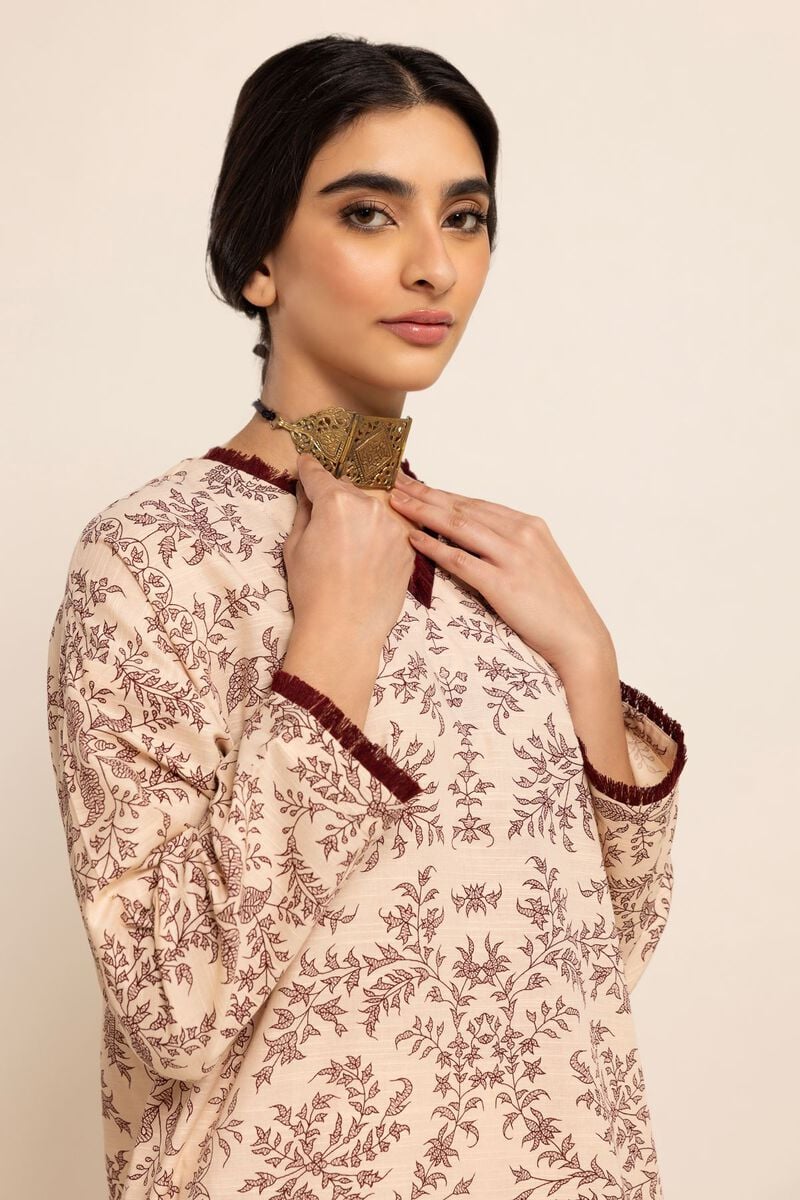 Close-Up of stitching of Khaadi’s cotton kurta, highlighting premium winter fabric for Punjabi suits in Canada.