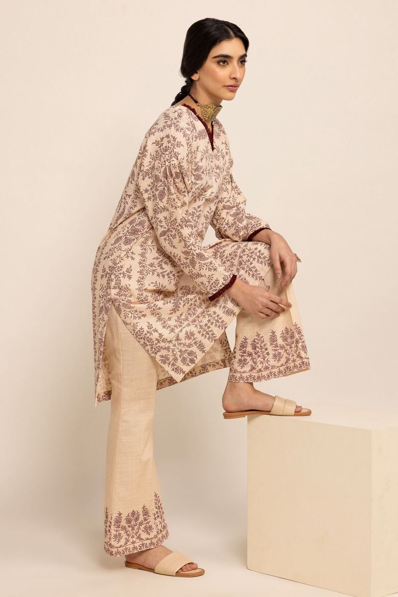 Left Side view of Khaadi’s winter kurta in champagne – a stylish Pakistani suit for women in Canada.