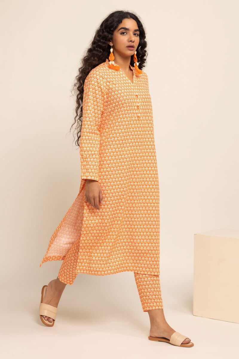 Side profile of Khaadi’s orange cotton kurta, showcasing its stylish fit – a must-have Punjabi suit for women in Canada.