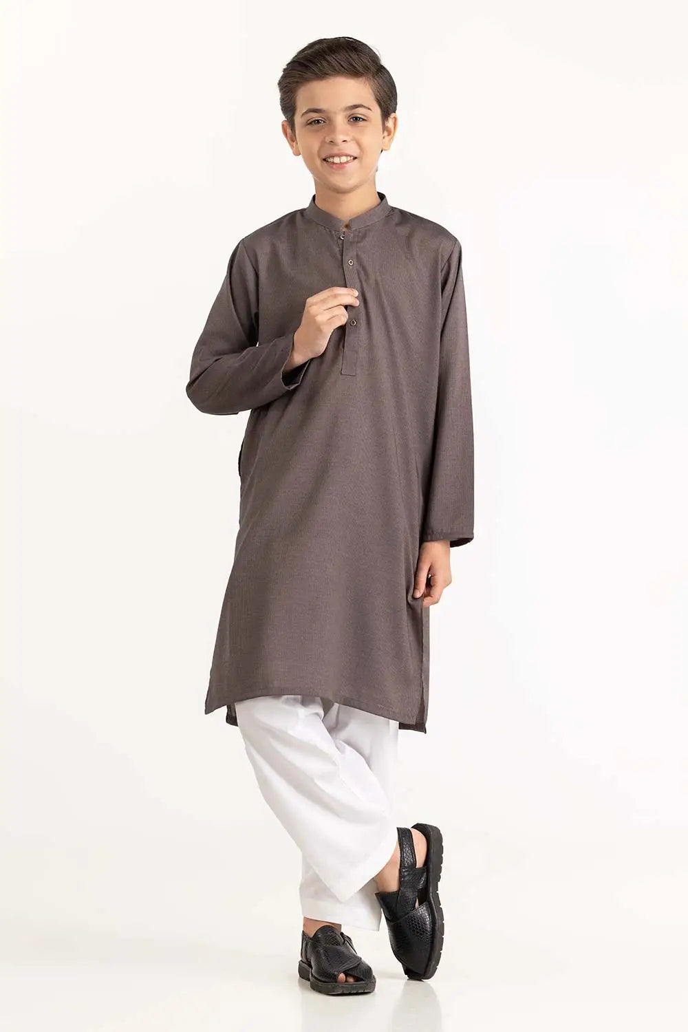 Front View of a a young boy wearing a stylish grey blended kurta from GulAhmed – a top pick for traditional Pakistani clothes for kids in Canada.