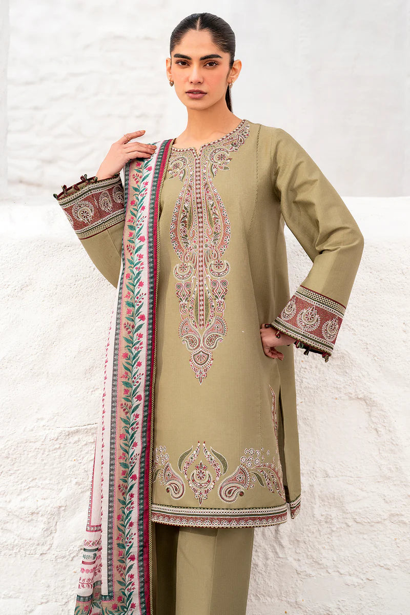 Woman wearing a traditional outfit with embroidery, holding a matching dupatta against a white background.