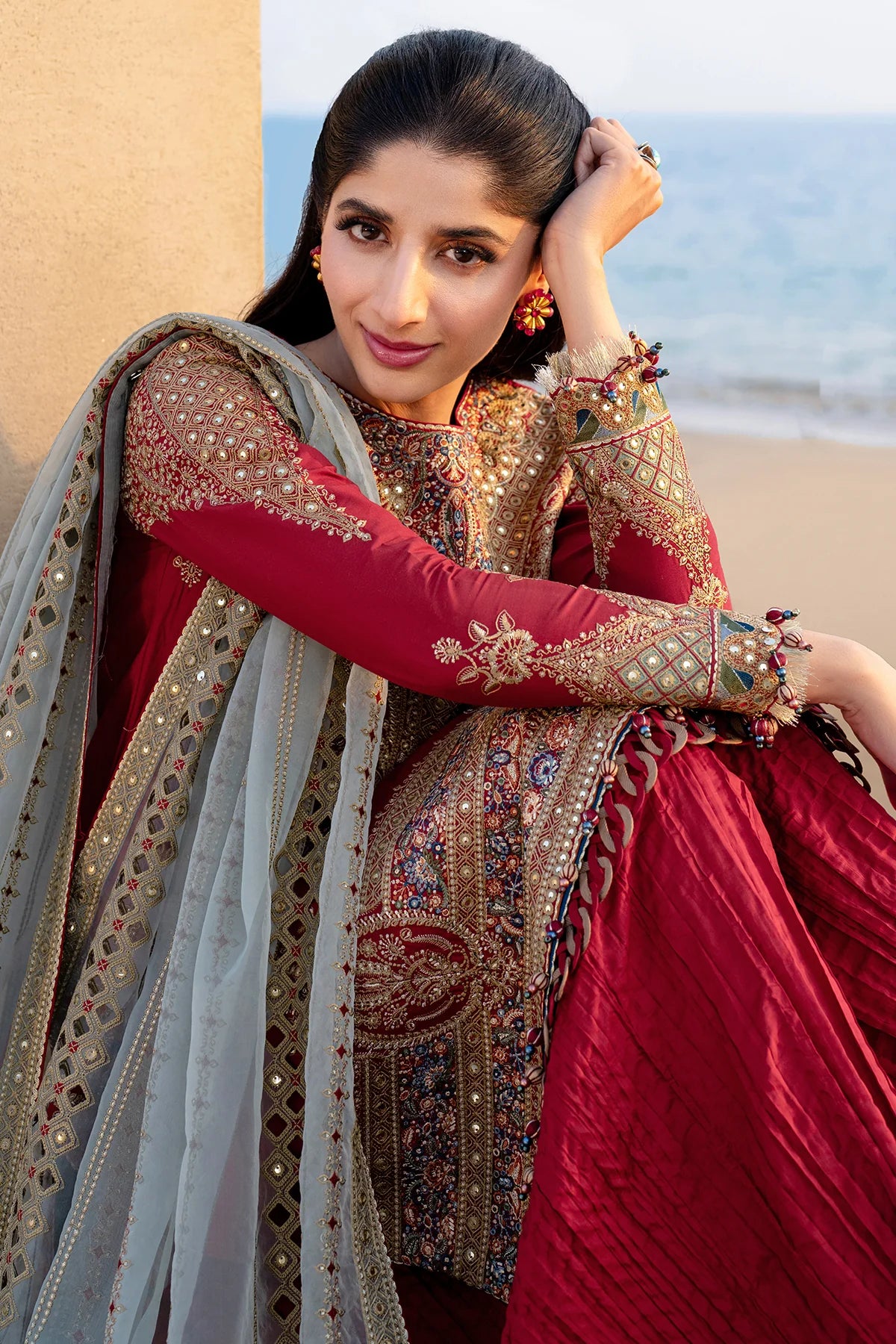 Woman wearing Jazmin three-quarter view leaning crimson embroidered kurta silver organza mirror-work dupatta red sharara formal Canada