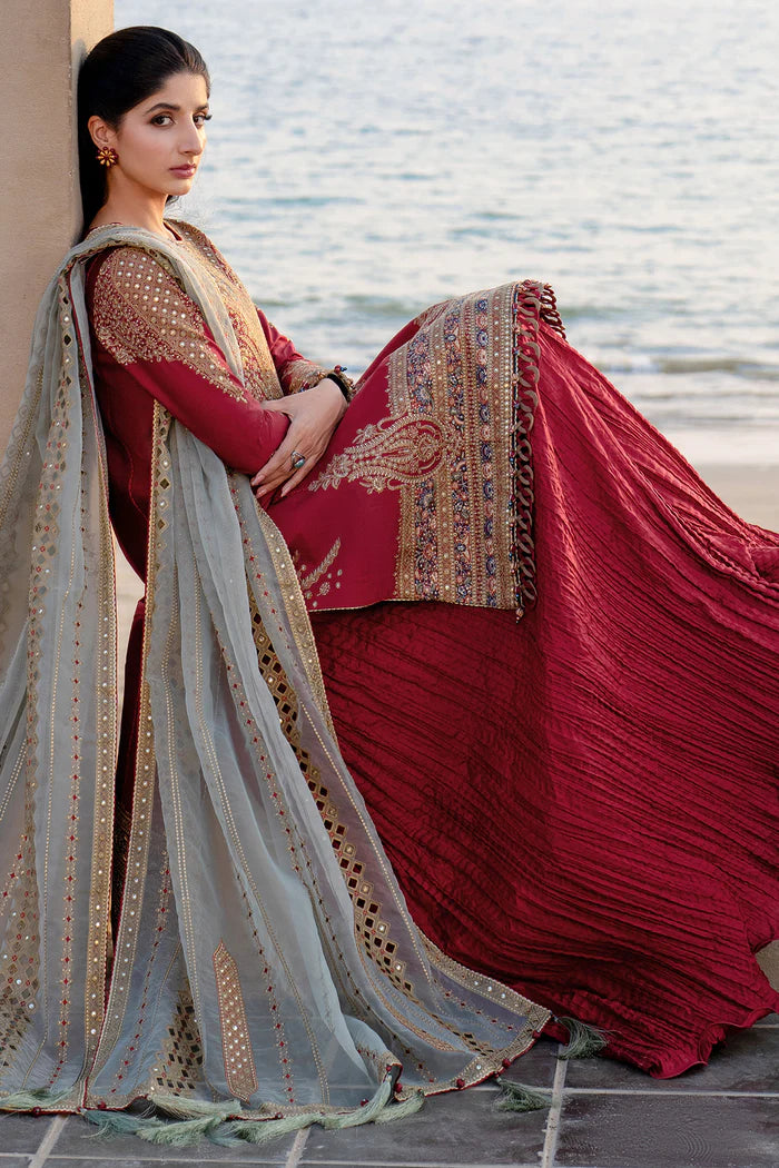 Woman wearing Jazmin side view leaning crimson embroidered lawn kurta silver dupatta gold mirror-work red crushed sharara Canada