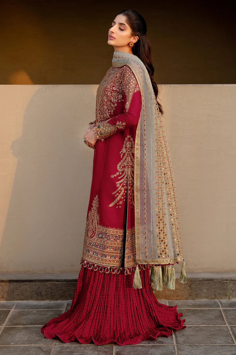 Woman wearing Jazmin side view leaning crimson embroidered lawn kurta silver dupatta gold mirror-work red crushed sharara Canada