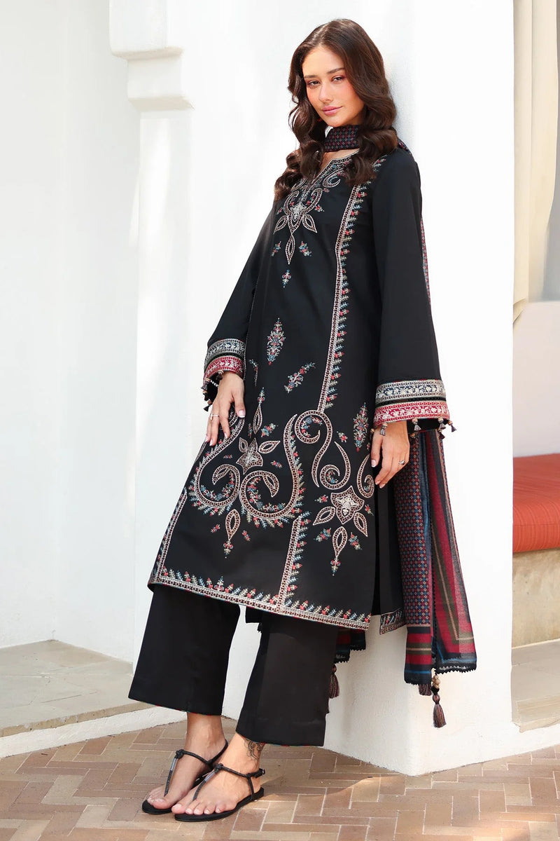 Woman standing front angled view – Jazmin JAZ-418 black embroidered lawn Punjabi suit gold paisley – Pakistani suits Canada Eid 