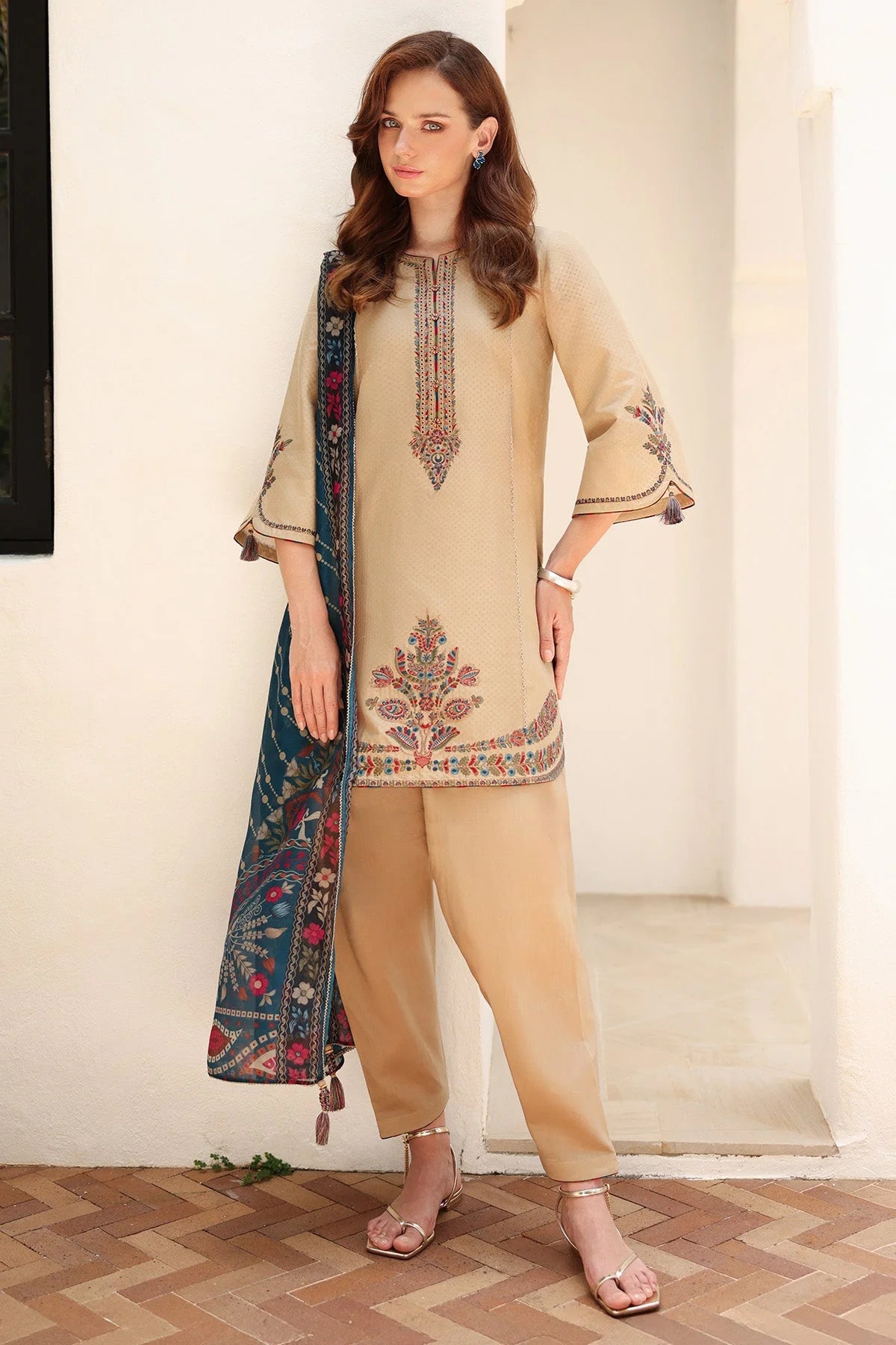 Woman standing front view – Jazmin JAZ-419 beige dobby lawn embroidered Punjabi suit – Pakistani suits online Canada