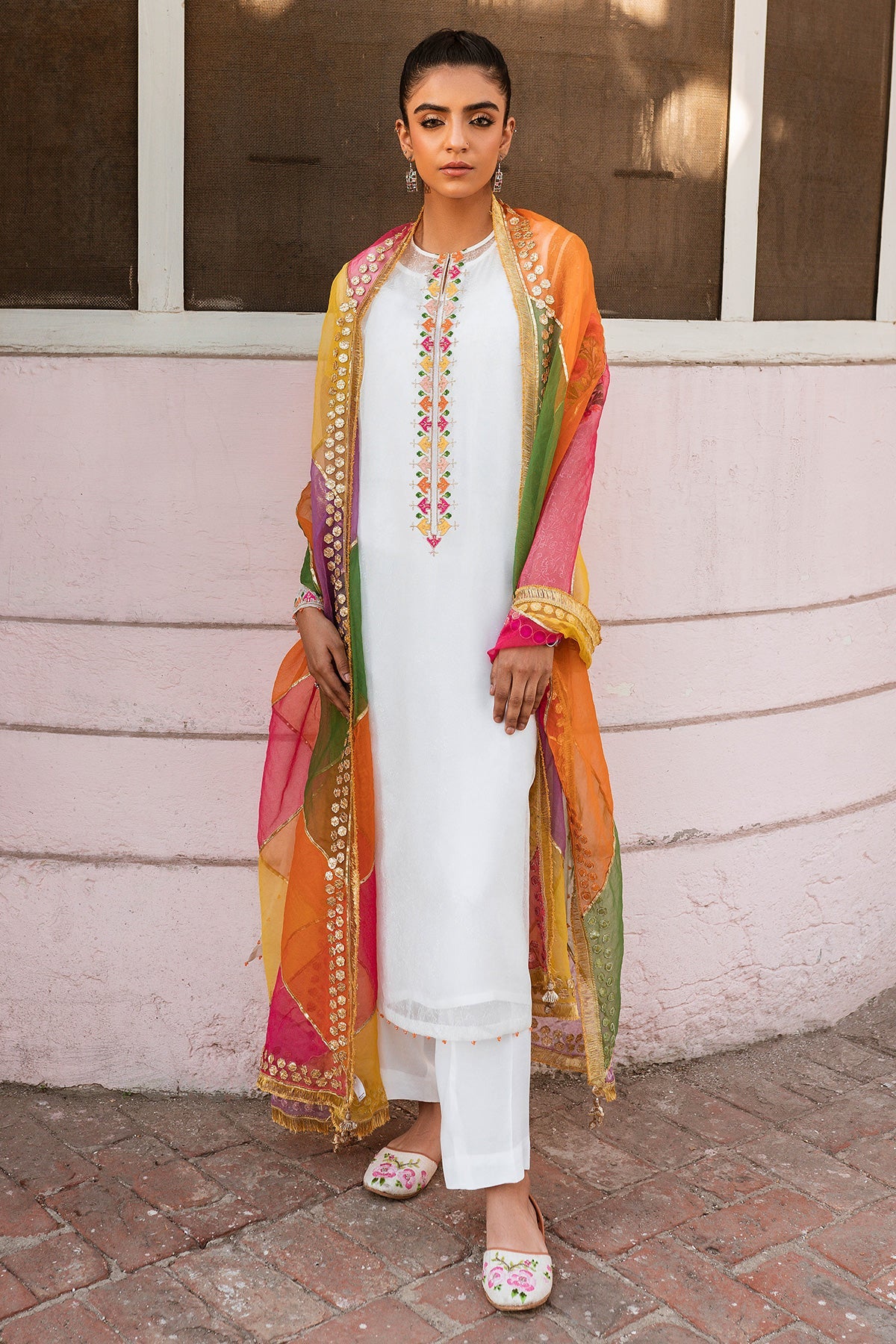 women wearing Keyseria white embroidered 4PC suit – a premium choice for Pakistani suits online in Canada, made with synthetic organza for a luxurious feel.
