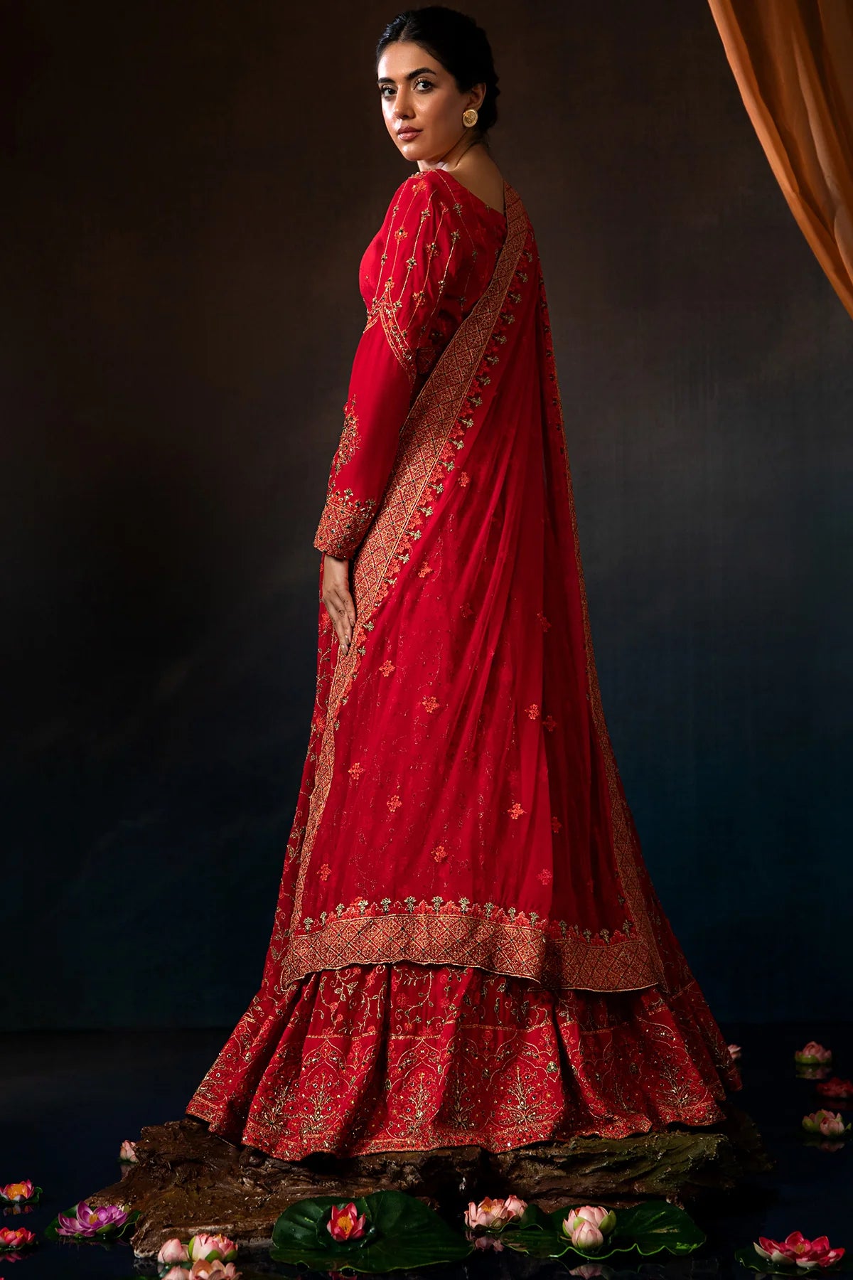 women showing Back view of the maroon Kayseria raw silk suit, designed for Pakistani suits lovers in Canada, perfect for special occasions.