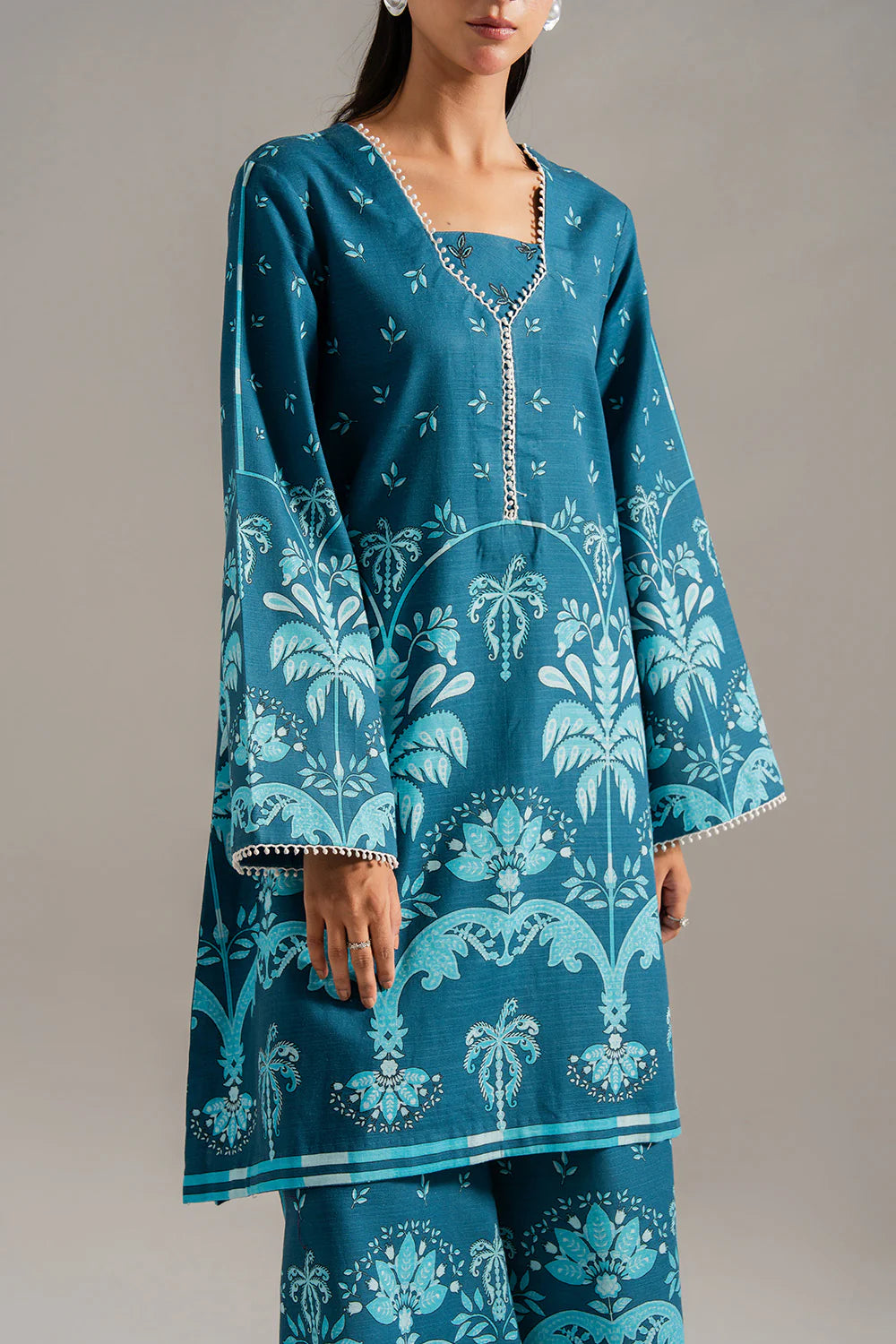 Woman front view full length straight pose teal printed khaddar suit Maryum N Maria Eid Pakistani suits online Canada women