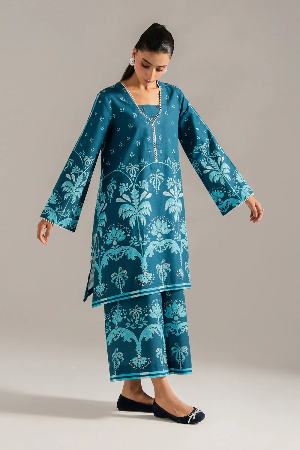 Close-up portrait teal khaddar suit lace trim neckline cuff detail Maryum N Maria Eid Diwali Pakistani suits Canada women