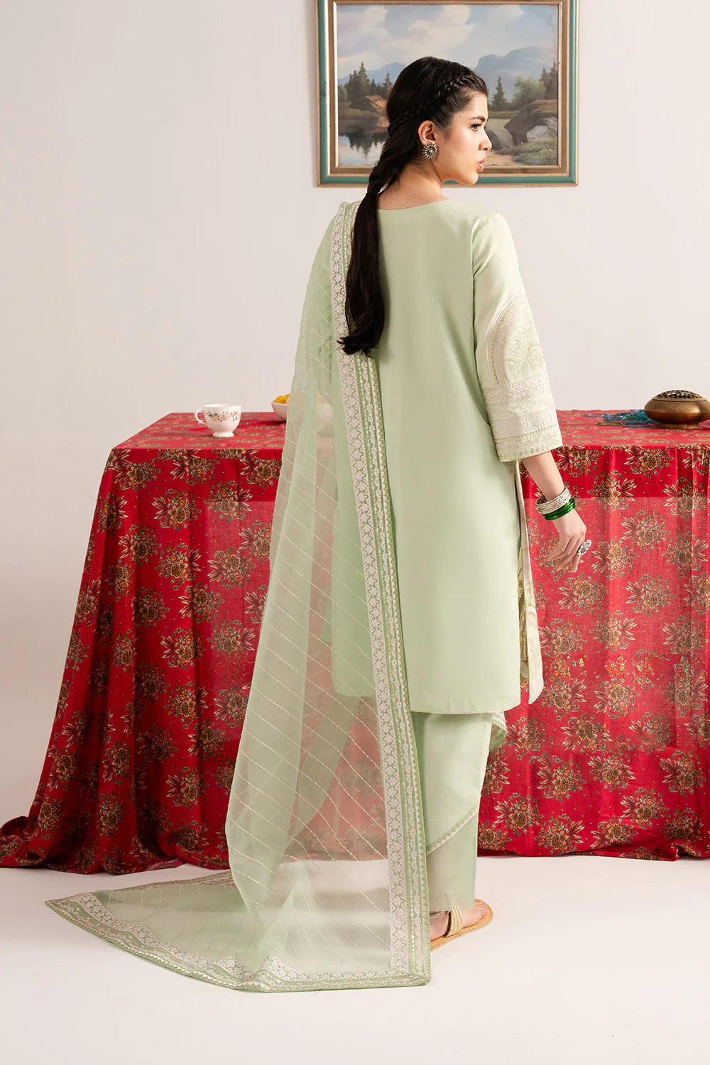 Woman standing back view full length mint embroidered lawn 3-piece suit organza dupatta Maryum N Maria Eid Pakistani suits Canada