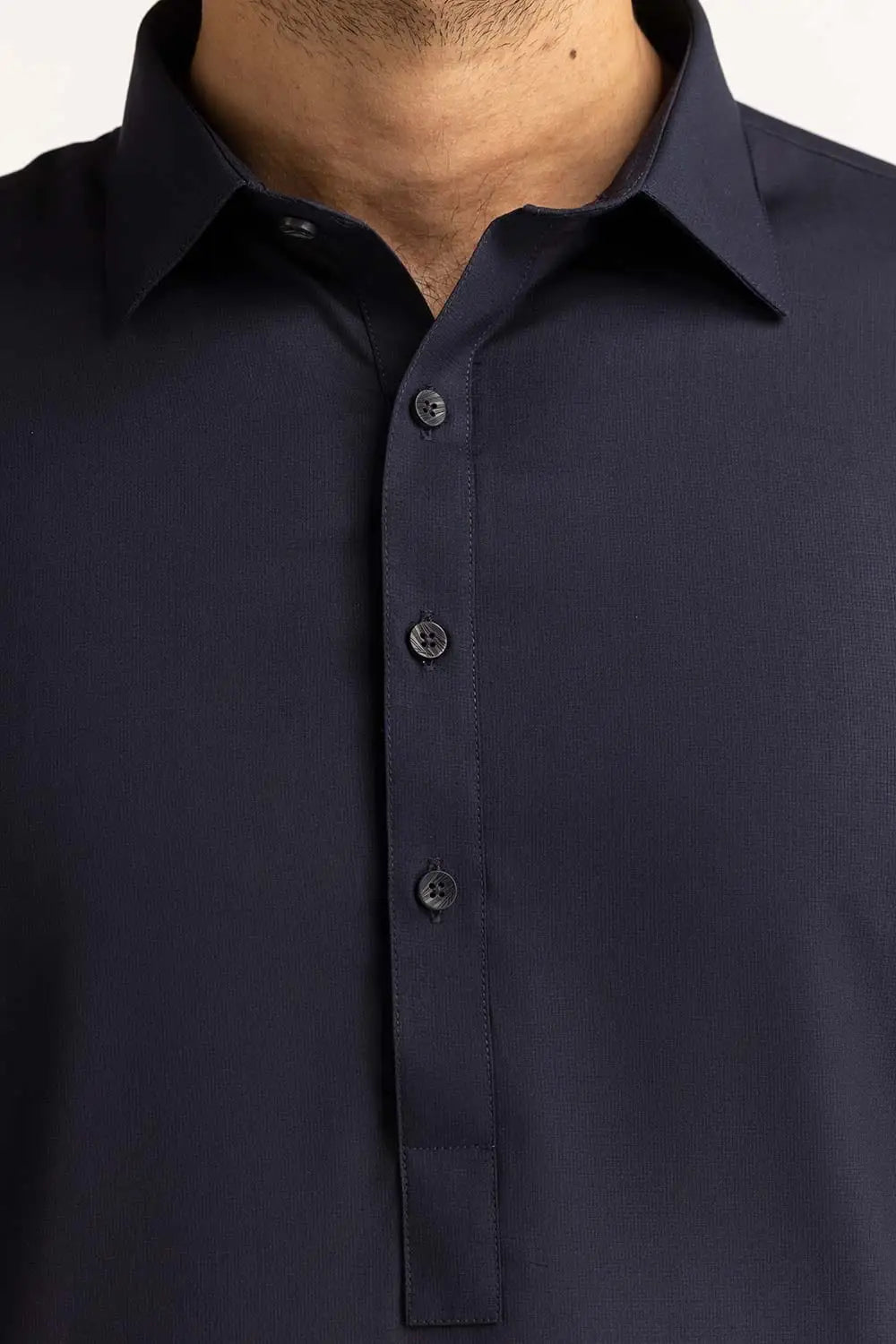 closview of the GulAhmed navy blue suit, showcasing its sleek and tailored fit – a must-have Pakistani suit in Canada. 
