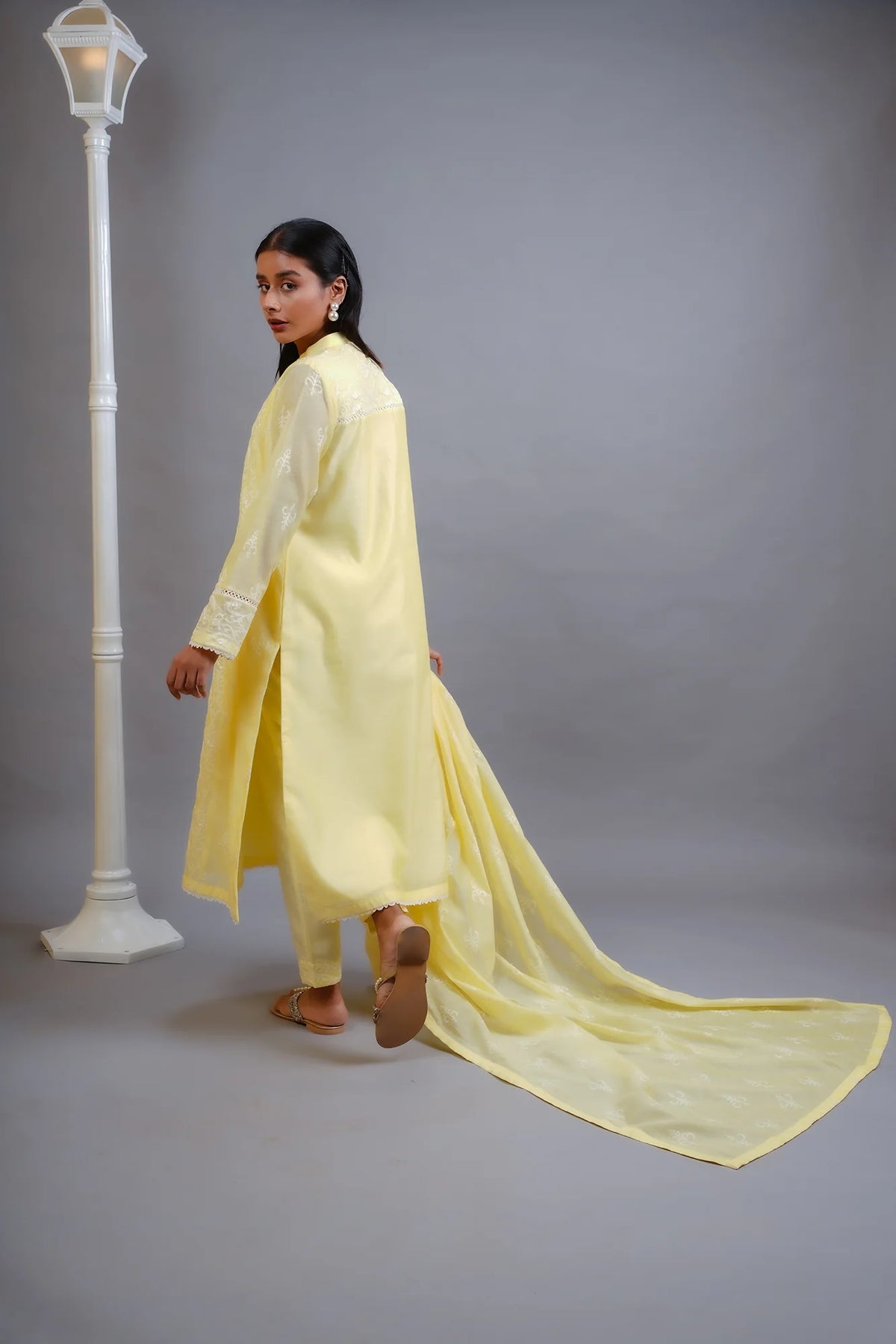 Woman side view holding dupatta SHEEP yellow cotton net 3-piece Pakistani suits Canada women