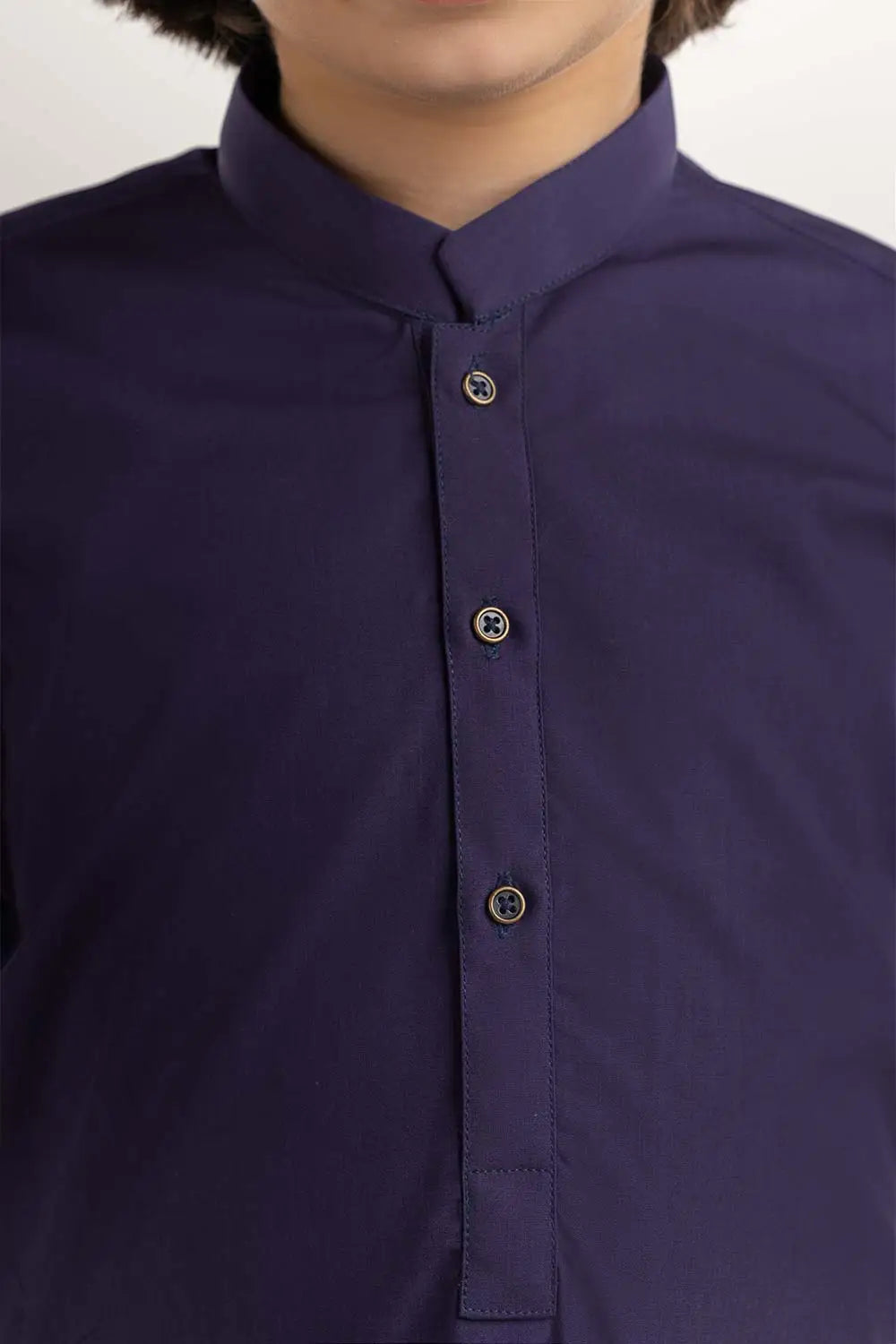 close up of cotton-polyester fabric of GulAhmed’s dark purple kurta, ensuring durability and comfort for kids' Pakistani suits in Canada.