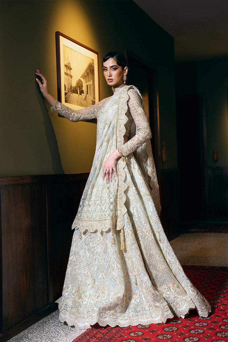 Slight side front view of elegant net bridal dress by Saira Rizwan – perfect Punjabi suits inspiration.