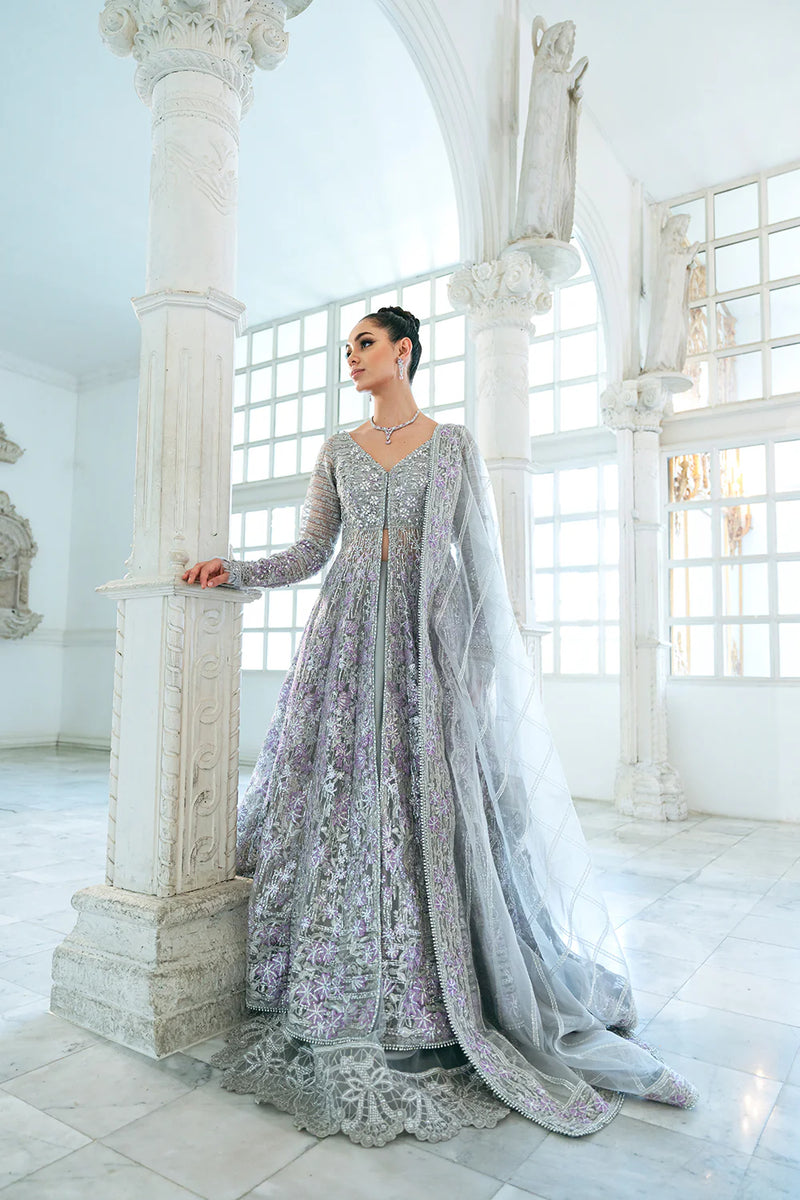 Elegant medium-size model displaying Saira Rizwan grey embroidered 3-piece outfit, a perfect Punjabi suits choice for festive occasions.
