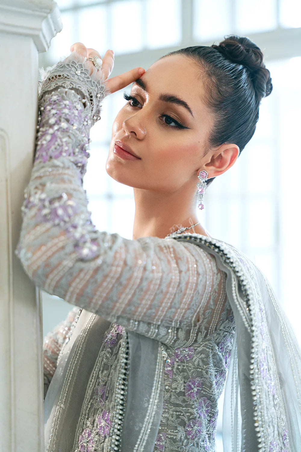 Chic side angle of medium-size Saira Rizwan embellished lehnga outfit, featuring premium traditional Pakistani clothes.
