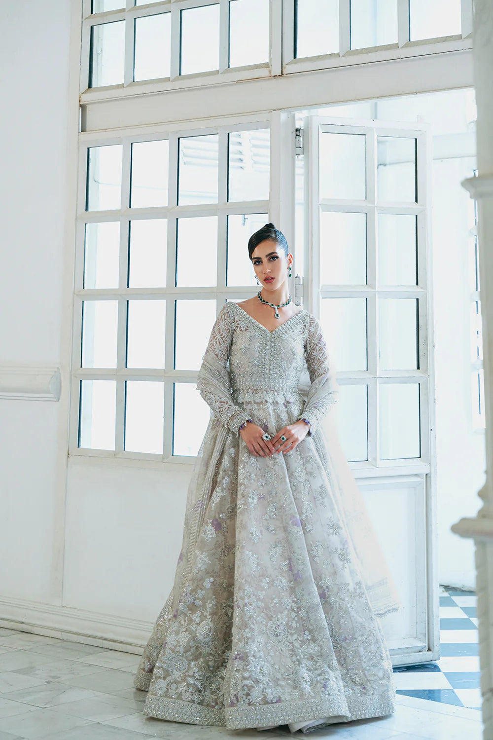 Front view of stunning Traditional Pakistani clothes white organza bridal outfit for women - size Medium
