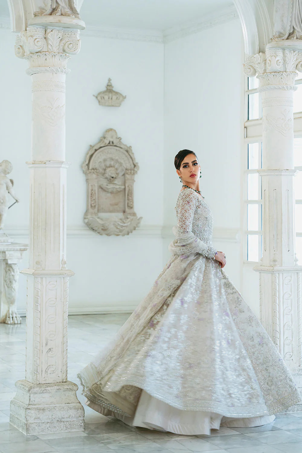 Back view displaying the rich embroidery on Punjabi suits inspired white organza bridal dress