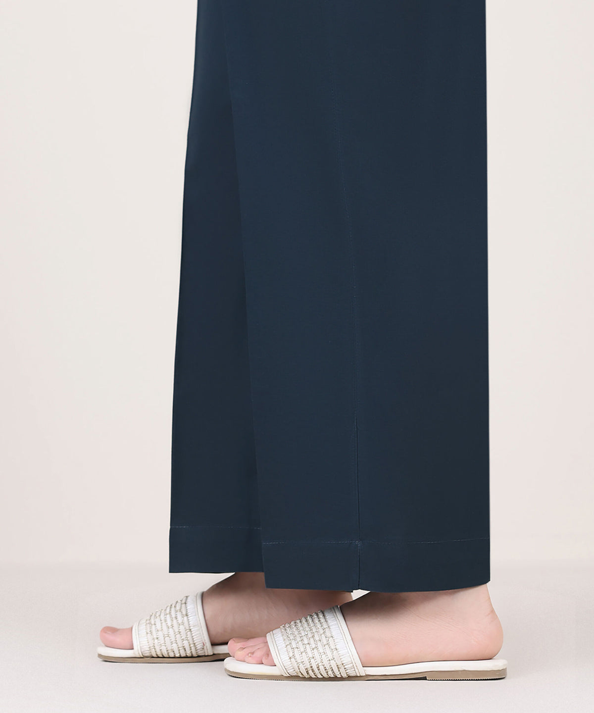Woman side close-up Sapphire blue solid cambric straight pants side slit detail – Pakistani suits online Canada