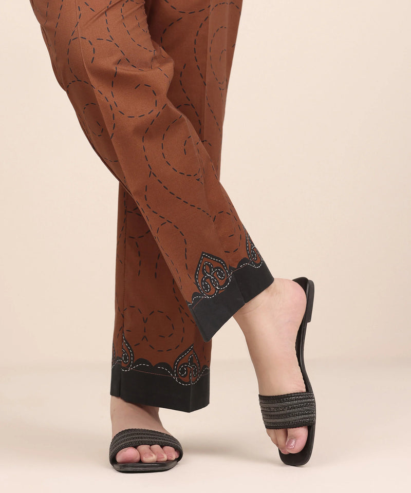 Woman front view close-up Sapphire brown cambric straight pants kantha stitch appliqué border Eid – Pakistani suits Canada