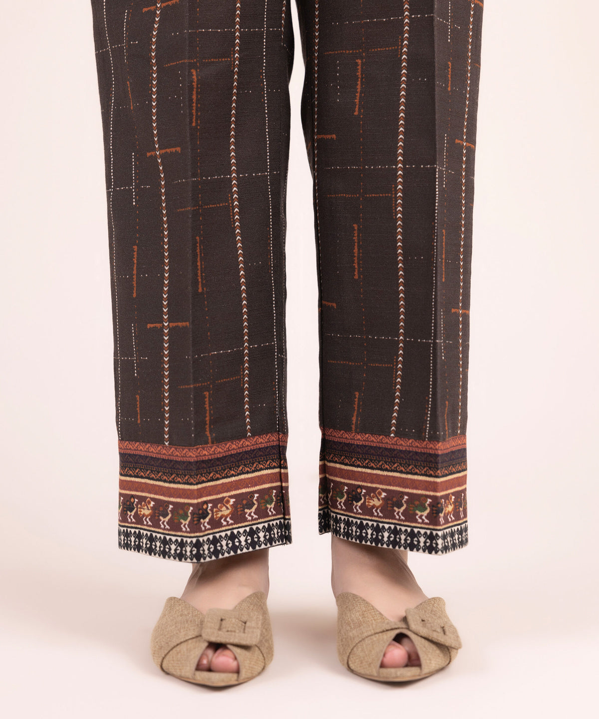 Woman standing front view Sapphire brown cotton Punjabi suits straight pants tribal border hem women Canada