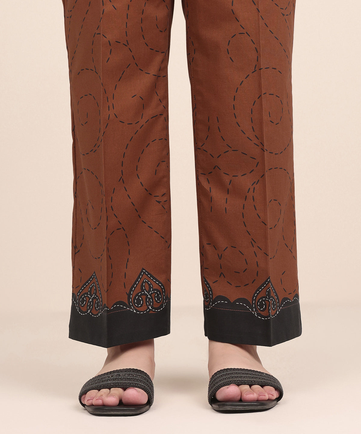 Woman side view close-up Sapphire brown kantha print cambric pants black appliqué scalloped border – Pakistani suits Canada