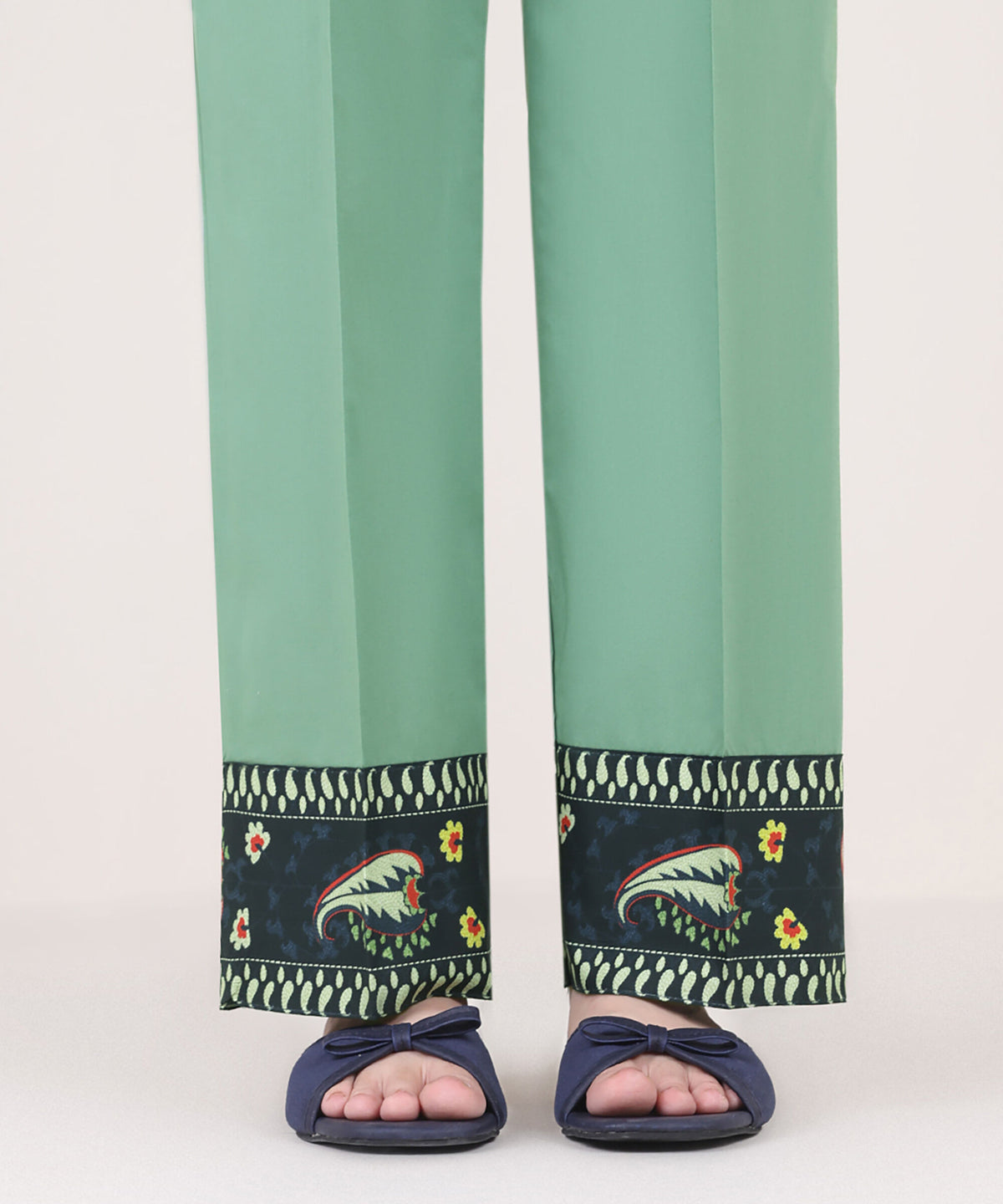 Woman front view mid-length Sapphire green cambric straight pants printed navy border Eid festive – Pakistani suits Canada