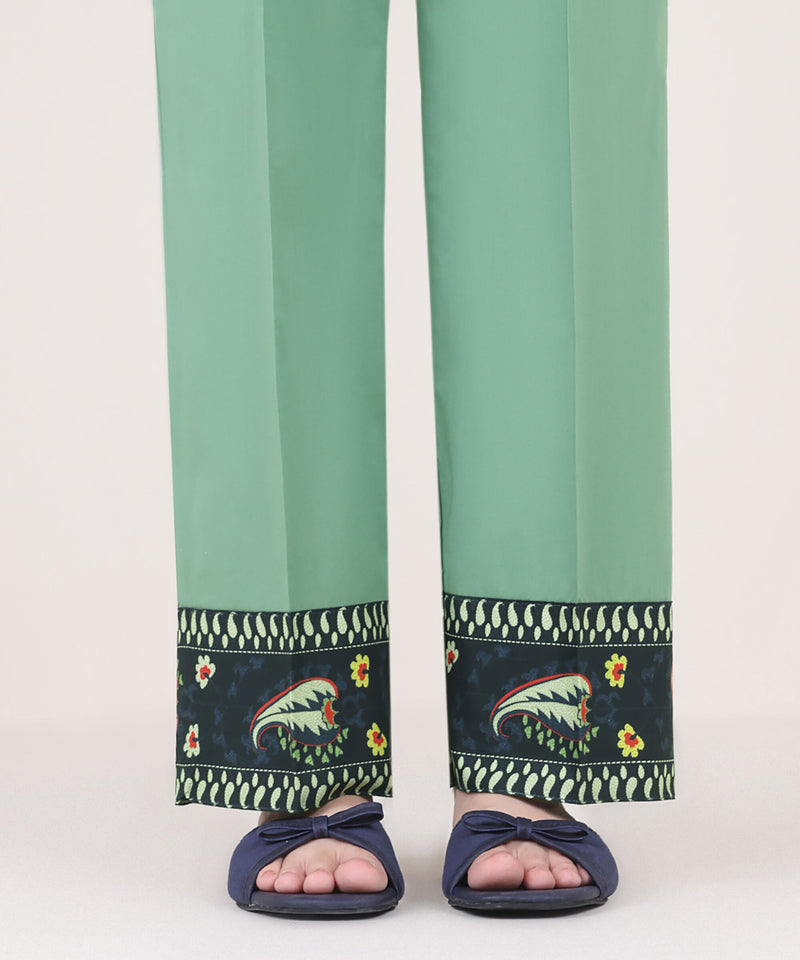 Woman front view mid-length Sapphire green cambric straight pants printed navy border Eid festive – Pakistani suits Canada