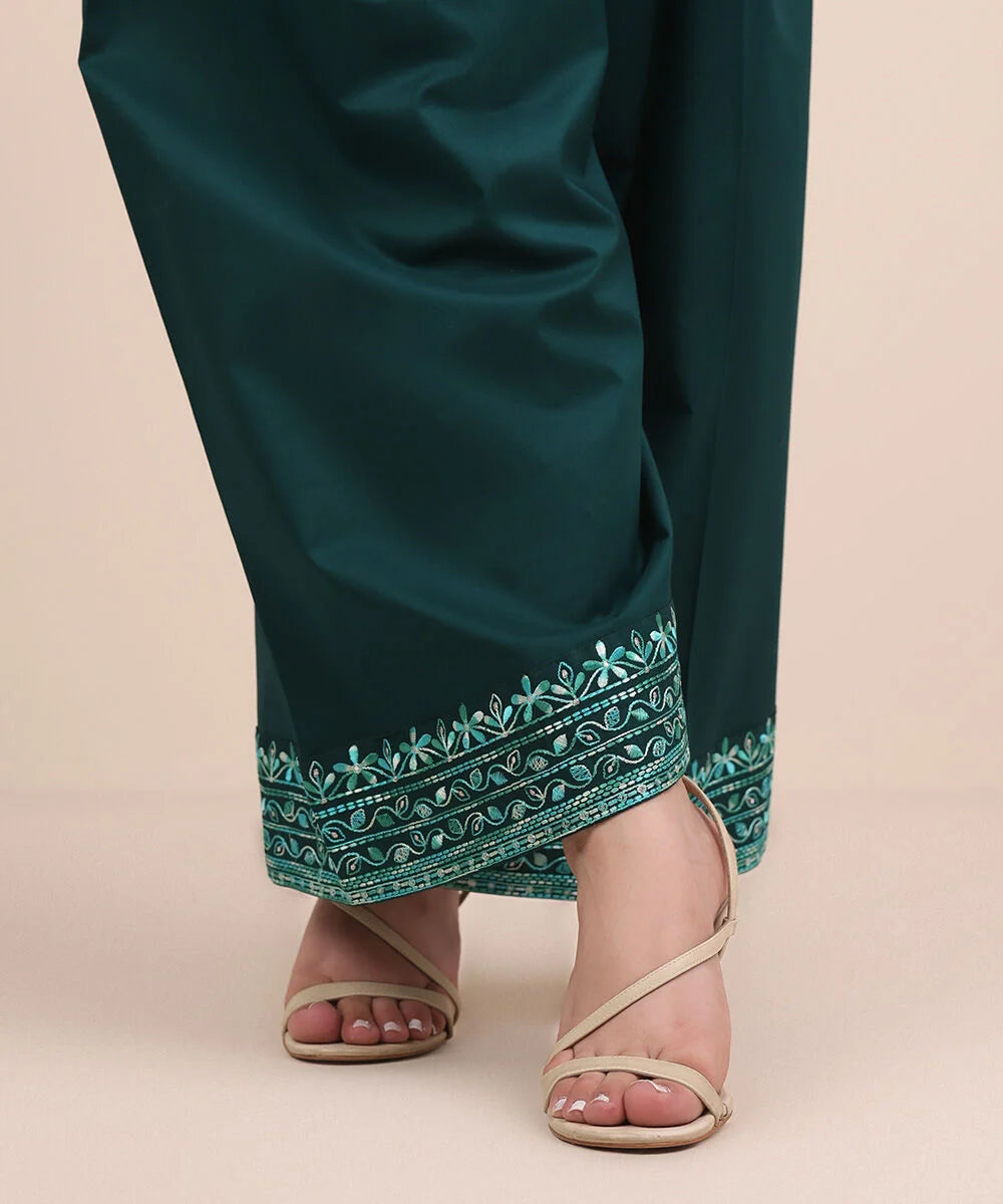 Woman close-up angled Sapphire green embroidered cambric shalwar floral paisley border – Pakistani suits Canada