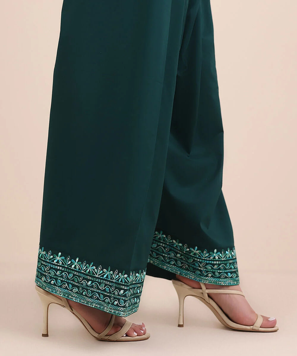 Woman walking front view Sapphire green embroidered cambric shalwar paisley border – Punjabi suits Canada