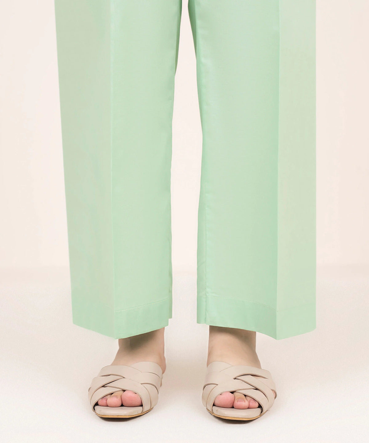Woman standing front view close-up Sapphire green solid cambric straight pants plain hem – Pakistani suits Canada