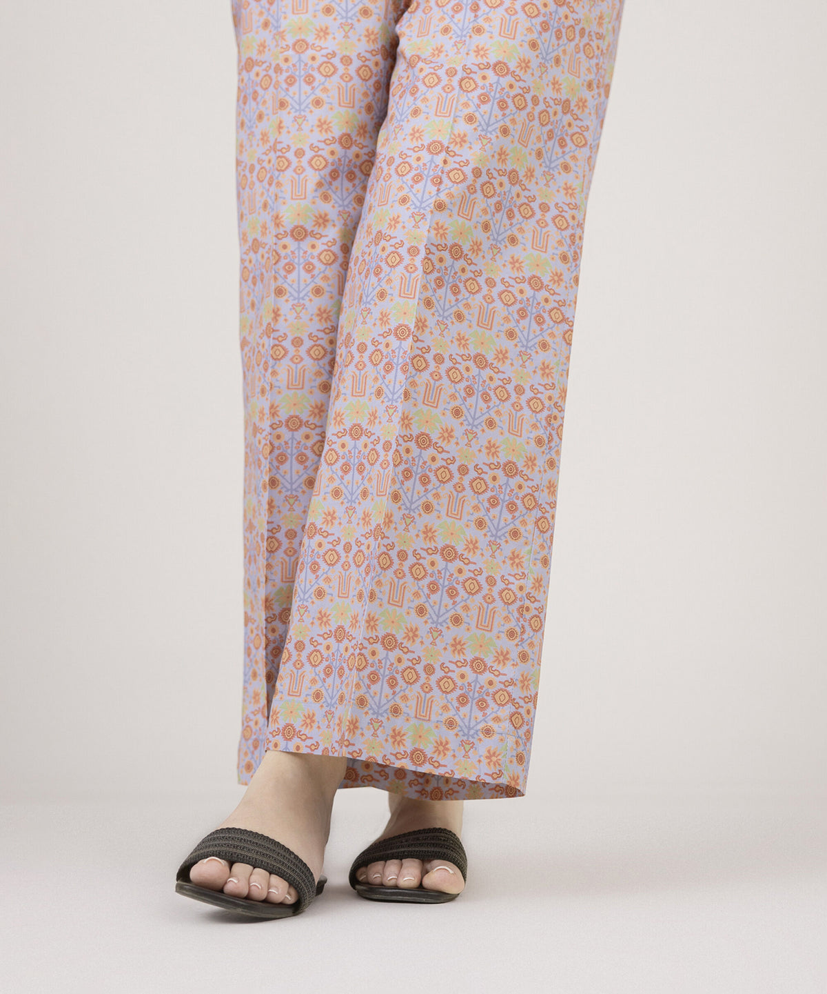 Woman angled front close-up Sapphire lavender printed cambric culottes folk floral side slit – Pakistani suits Canada