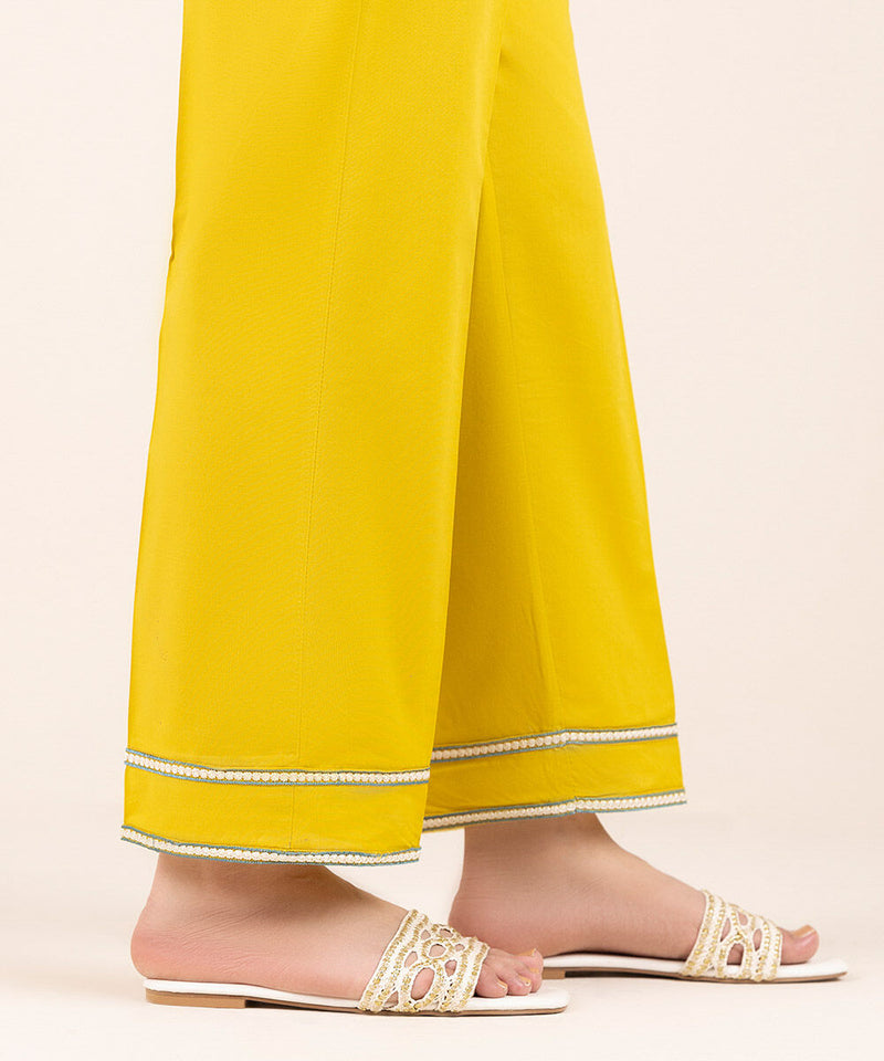 Woman walking side angle Sapphire mustard Punjabi suits wide-leg pants embroidered hem Pakistani suits Canada