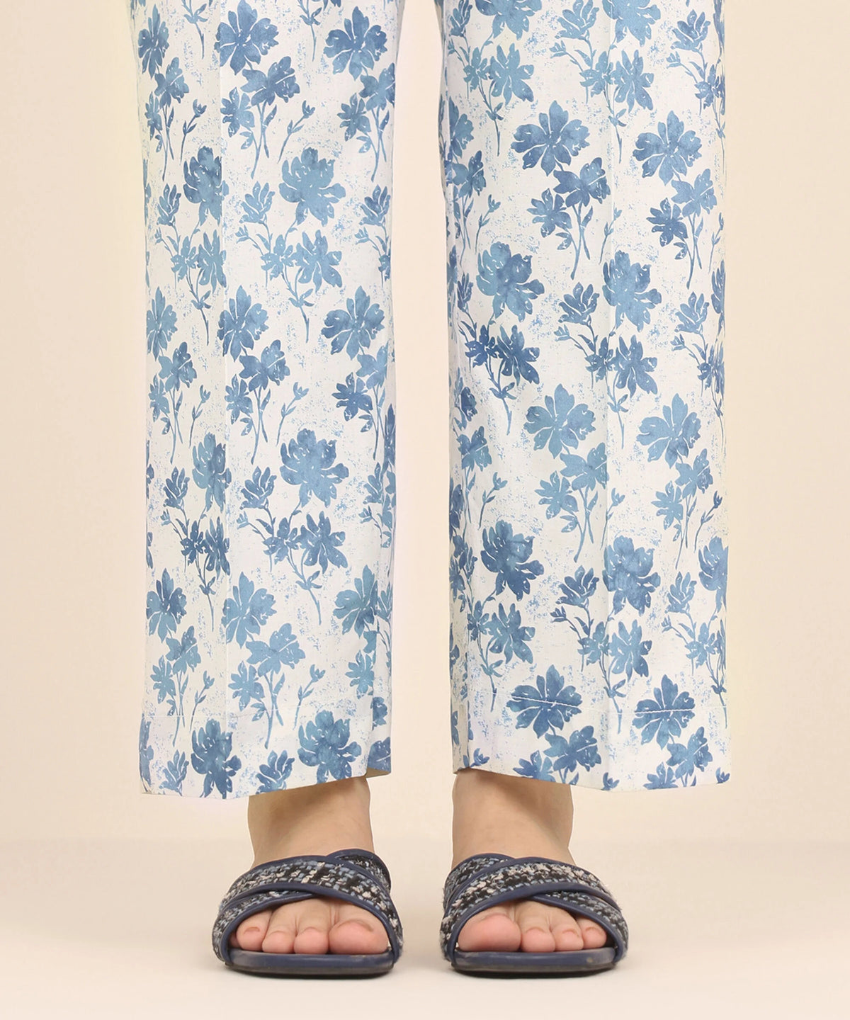 Woman standing front view Sapphire white Pakistani suits Canada cambric straight pants blue floral print women