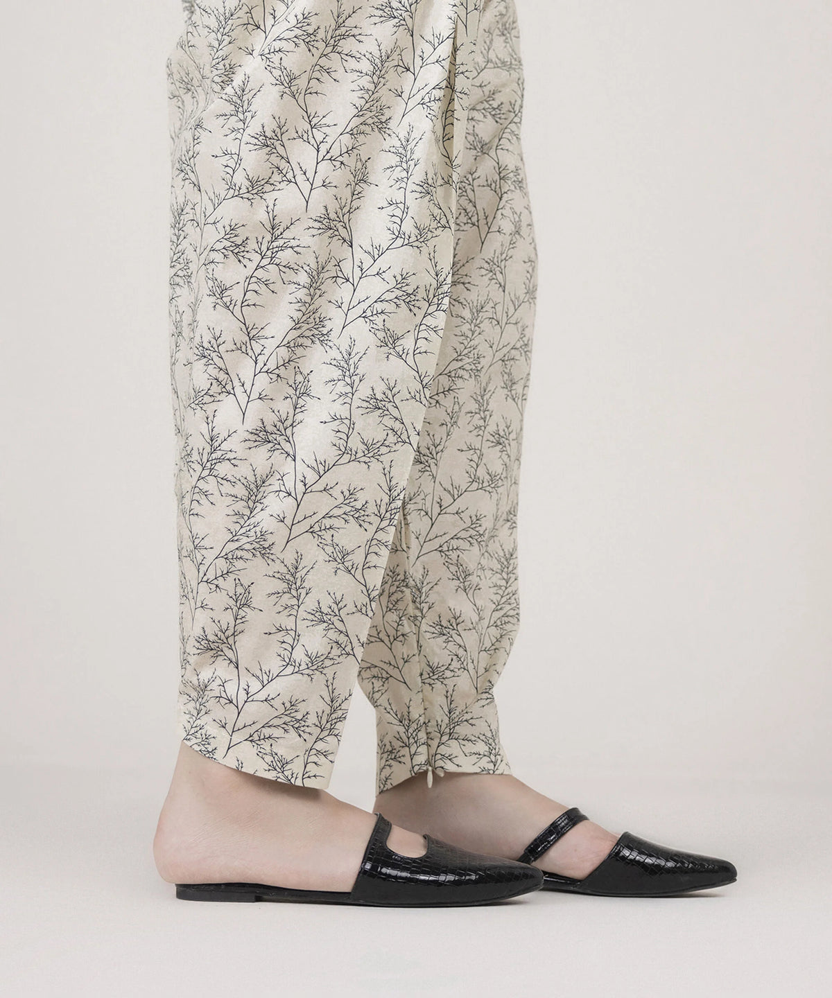 Woman side view full length Sapphire white printed cambric shalwar – Pakistani suits online Canada