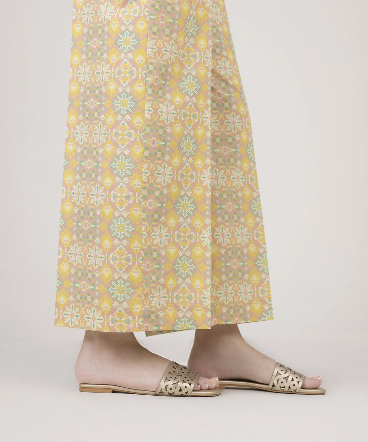 Woman side view both legs Sapphire yellow printed cambric culottes wide leg side slit open – Punjabi suits Canada