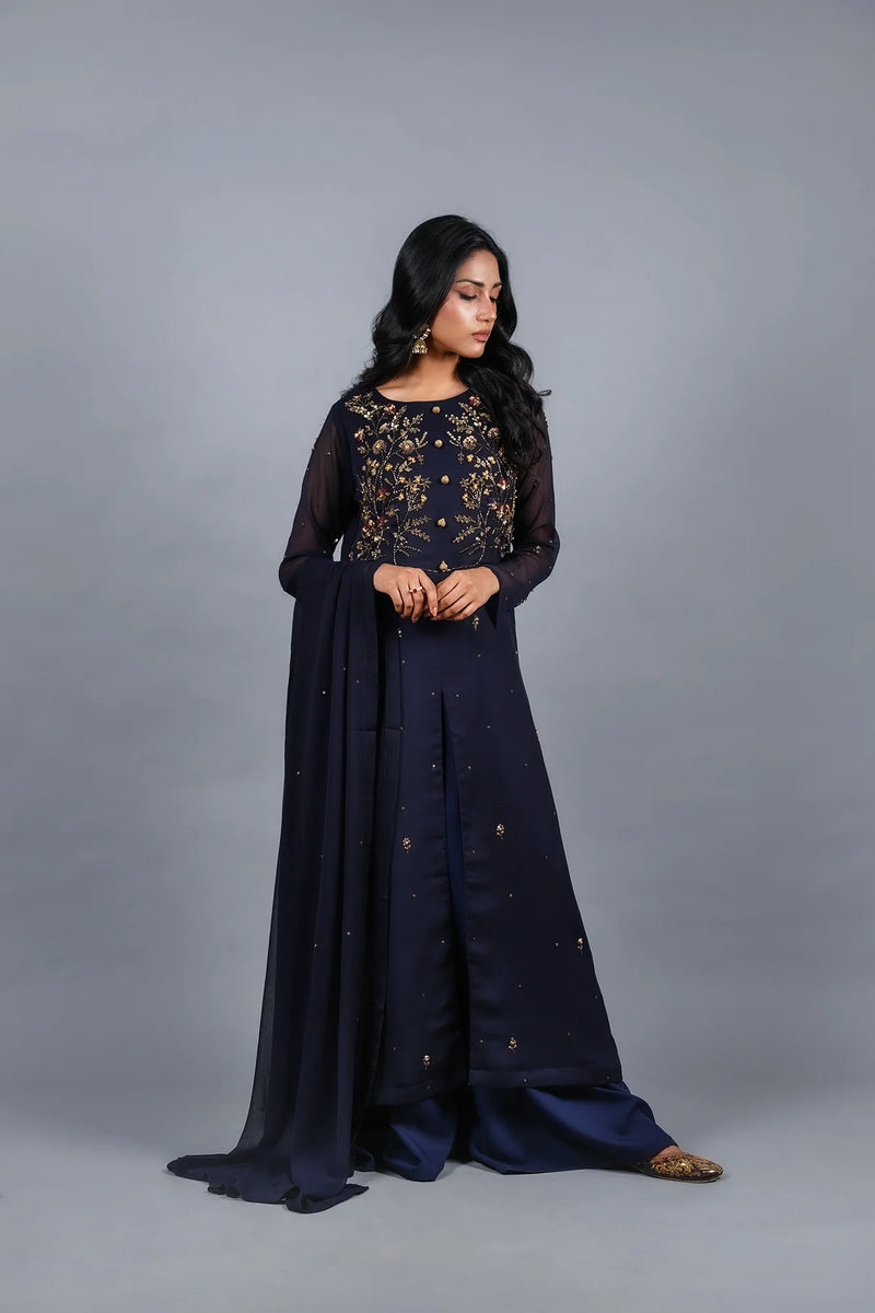 Woman graceful pose Sheep navy embellished chiffon gown - Pakistani wedding suits women Canada
