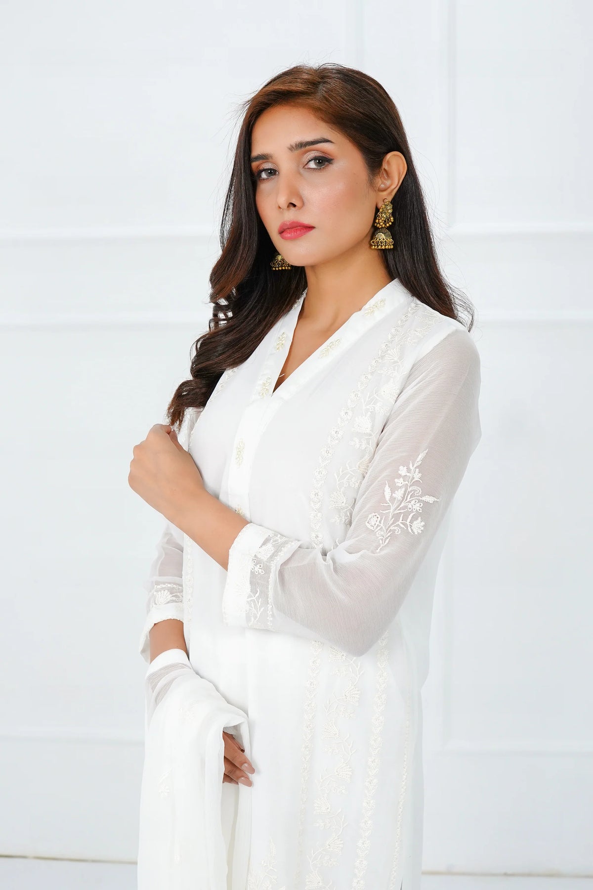 Woman standing side view SHEEP white chiffon Pakistani suit dupatta styling Canada wedding women