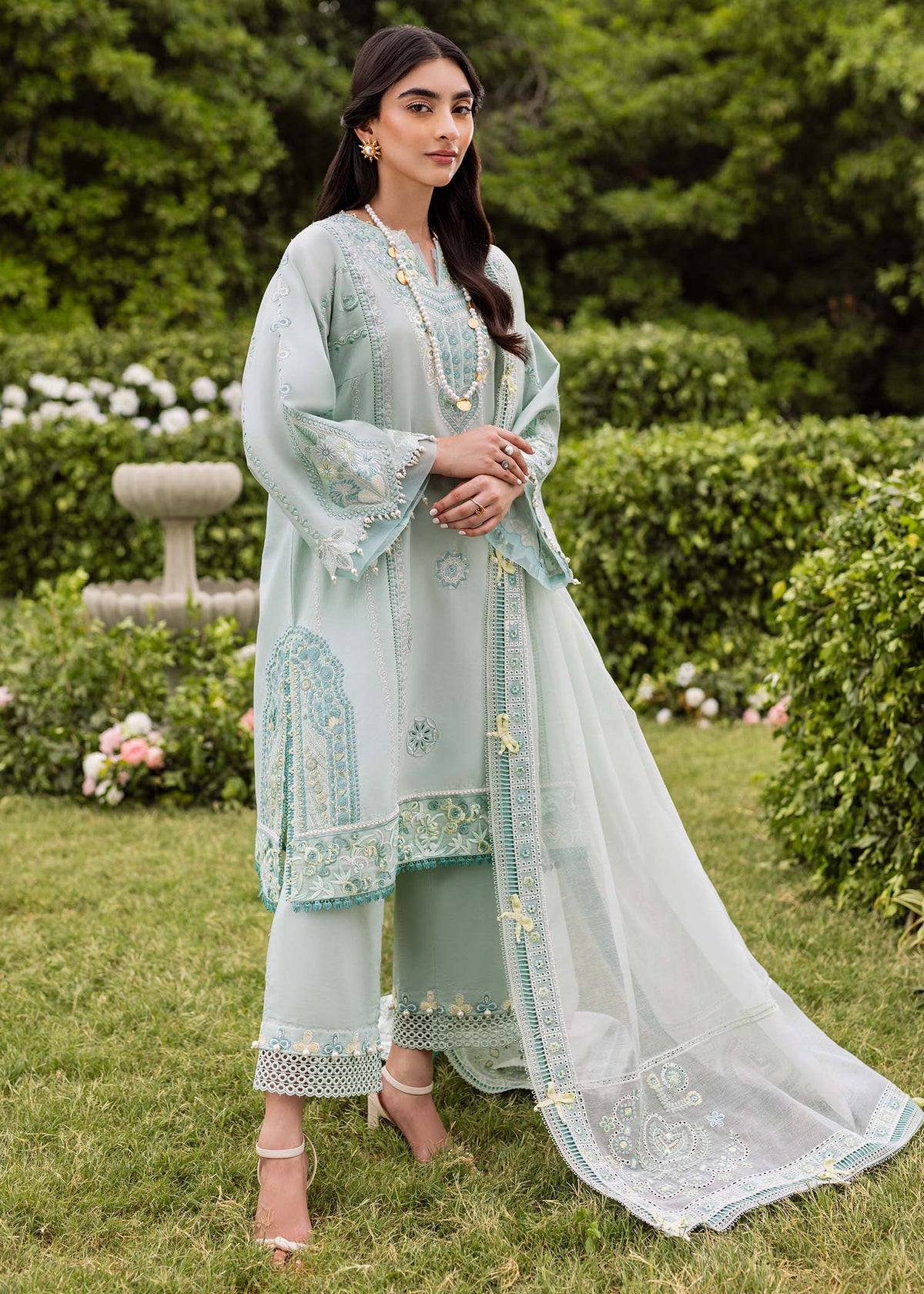 Pakistani top designers - Zaphira in Aqua by Brand Sadaf Fawad Khan with embroidered lawn and organza accents.