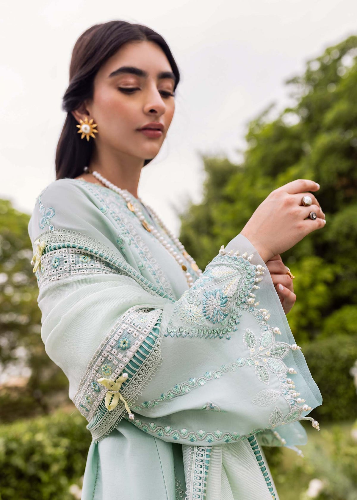 Pakistani top designer in canada - Zaphira in Aqua by Brand Sadaf Fawad Khan with embroidered lawn and organza accents.