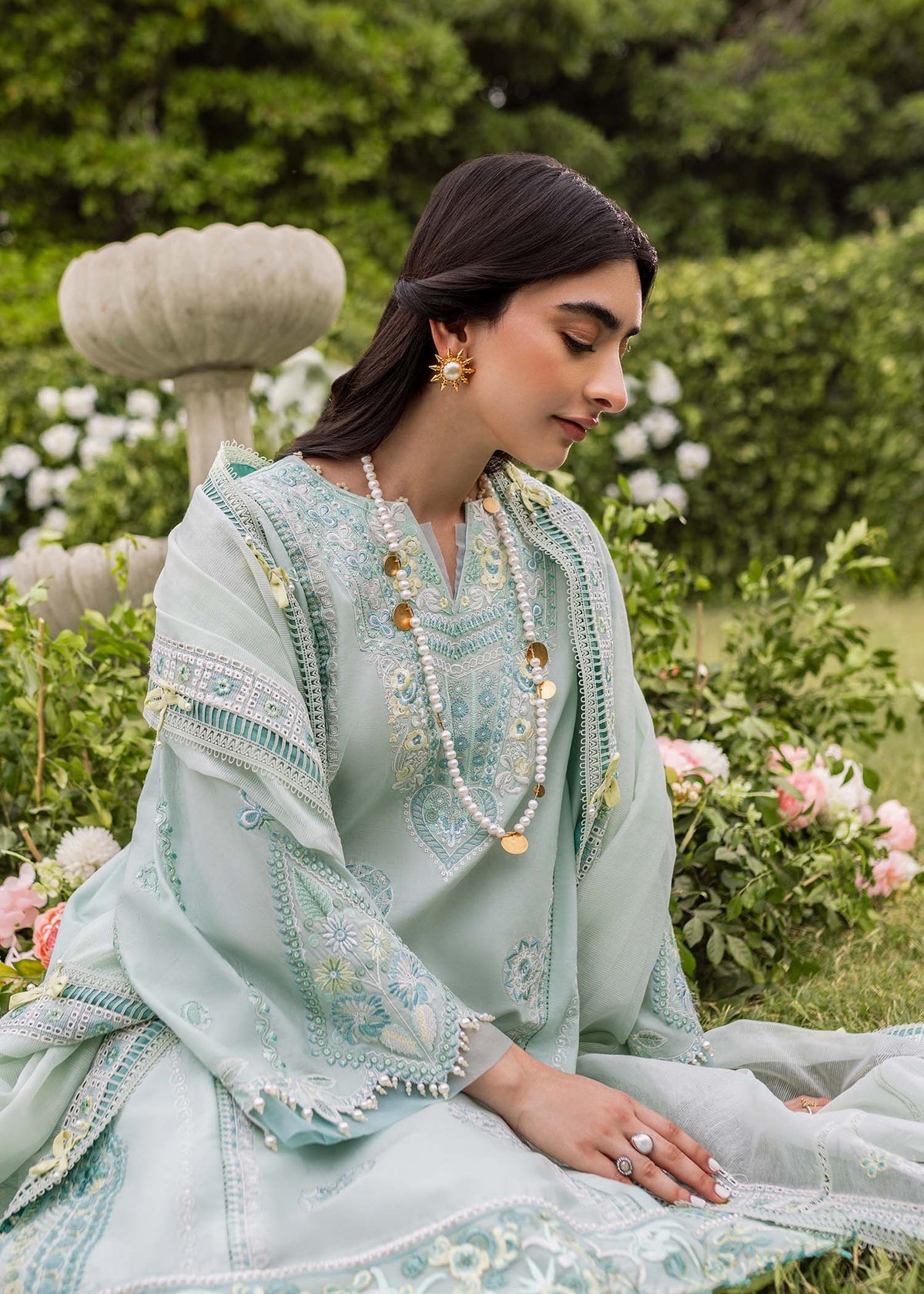 Pakistani top designers in canada- Zaphira in Aqua by Brand Sadaf Fawad Khan with embroidered lawn and organza accents.