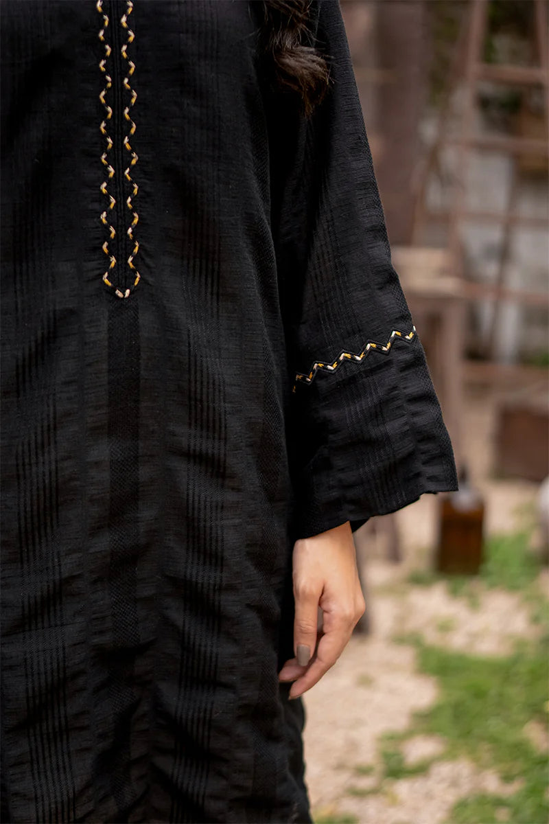 Woment showing sleeves of Punjabi suits in Canada with this elegant black lawn shirt by Armaas, perfect for casual wear.