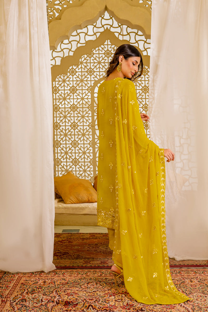 Woman standing back view mustard chiffon Pakistani suit dupatta Canada Sheep brand traditional wedding women